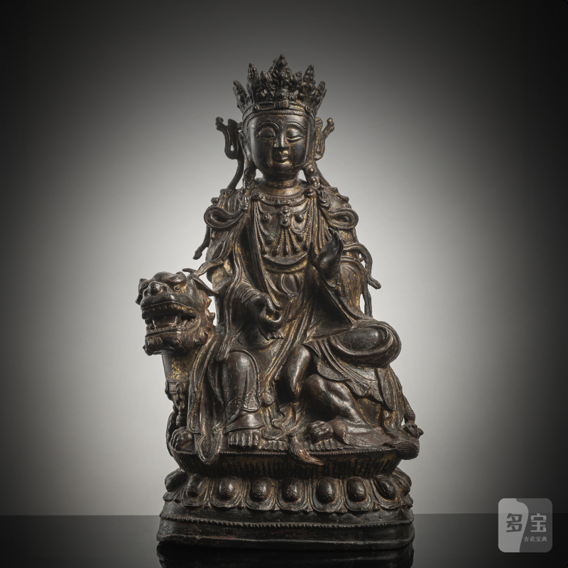 A BRONZE FIGURE OF GUANYIN